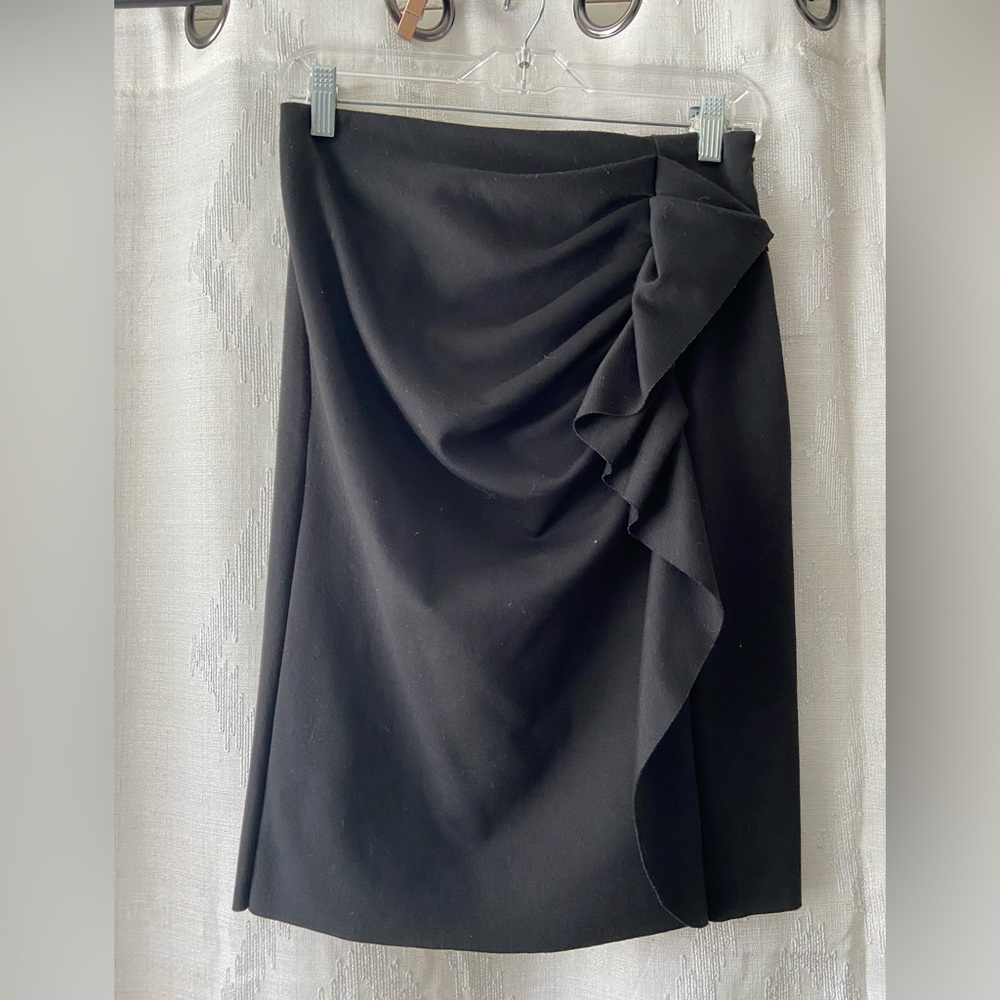 Black ruffled pencil skirt.